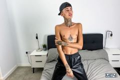 Men-young-English-twink-Logan-strips-nude-tight-black-jockstrap-jerking-big-dick-spraying-jizz-001-gay-porn-pics